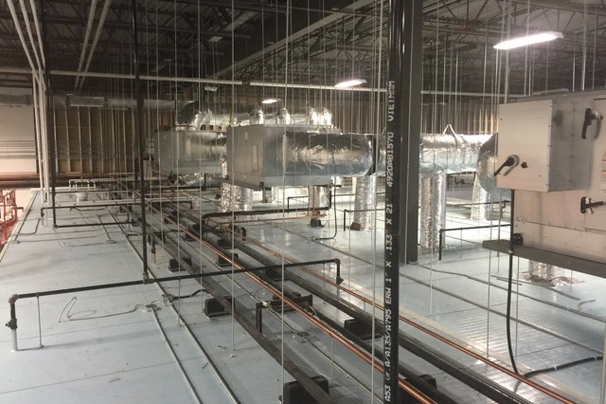 Wrapped ductwork and suspended air handling units in a large open fit-out